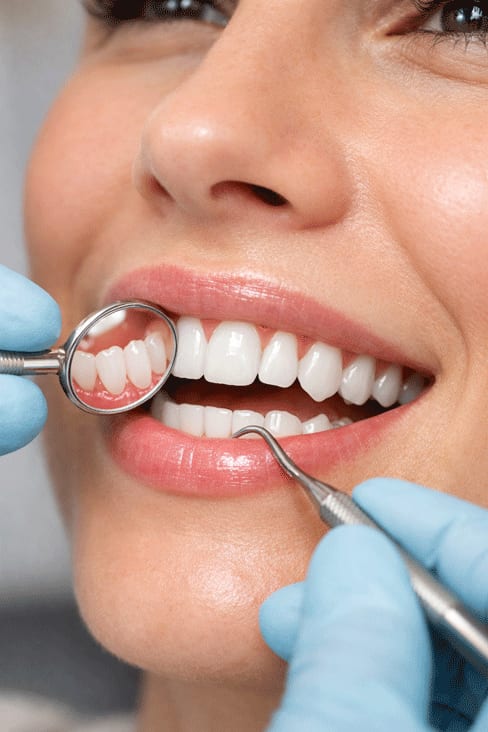 A hygienist carrying out a professional clean